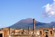 The Vesuvius on the background of Jupiter Temple in Pompeii ruins